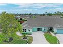 Charming single-story home featuring a well-manicured lawn, a two-car garage, and tranquil neighborhood setting at 3009 Live Oak Ln # 33, Palmetto, FL 34221