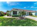Attractive single-story home with lush lawn, verdant landscaping, and inviting curb appeal at 3009 Live Oak Ln # 33, Palmetto, FL 34221