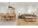 Bright living area with tiled floors, and a dining set, perfect for comfortable living and entertaining guests at 3456 Parkridge Cir # 33-105, Sarasota, FL 34243