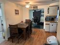 Cozy kitchen and dining area with ceiling fan and bright lighting, perfect for Gathering meals at 3525 Emory Dr, Holiday, FL 34691