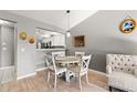 Cozy dining area with a round table, chair set, and modern lighting fixtures at 3605 60Th W St, Bradenton, FL 34209