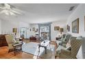 Bright and airy living room with hardwood floors and traditional furnishings at 4058 Oakhurst Dr # 3174, Sarasota, FL 34233