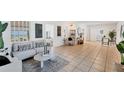 Bright living room featuring tile floors and ample natural light at 436 Parkview Dr, Sarasota, FL 34243