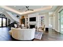 Cozy living room with fireplace, built-in shelves, and comfortable seating at 511 Bayview Dr, Holmes Beach, FL 34217