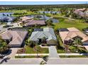 Beautiful aerial view of home, golf course, and lakes in a gated community at 5270 White Ibis Dr, North Port, FL 34287