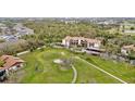 Aerial view of a lovely condo community with golf course and lush green surroundings creating a peaceful atmosphere at 6002 Oak Creek Ln # 1925, Bradenton, FL 34210