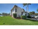 Well-maintained condo building with lush landscaping and waterfront views at 7231 W Country Club N Dr # 231, Sarasota, FL 34243