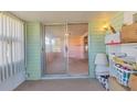 Inviting Florida room featuring a sliding door that opens to the living area at 1224 41St Avenue E Dr, Ellenton, FL 34222