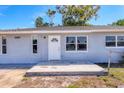 Charming single-story home featuring a well-maintained lawn, a concrete driveway, and a classic exterior design at 2406 Lehigh Ave, Bradenton, FL 34207