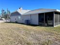 Spacious backyard with a screened-in patio, ideal for outdoor relaxation and entertainment at 3608 67Th Street Ct W, Bradenton, FL 34209