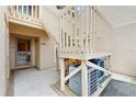 Condo entrance with a set of stairs, a bicycle, and two AC units underneath it at 6342 7Th W Ave # 6342, Bradenton, FL 34209