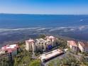 Aerial view of waterfront condo community with boat access and beautiful landscape at 6460 Mourning Dove Dr # 204, Bradenton, FL 34210