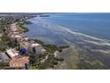 Aerial view of waterfront condo community with boat access and adjacent shoreline at 6460 Mourning Dove Dr # 204, Bradenton, FL 34210