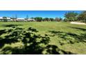 An expansive golf course view showcasing meticulously maintained greens and lush fairways at 6505 Stone River Rd # 306, Bradenton, FL 34203