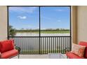 Enclosed balcony with lake and golf course view at 7015 River Hammock Dr # 204, Bradenton, FL 34212