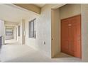 Hallway with windows leading to front door at 7015 River Hammock Dr # 204, Bradenton, FL 34212