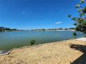 Scenic waterfront view showcasing a serene lake, providing a tranquil backdrop for lakeside living at 808 53Rd E Ave # 273, Bradenton, FL 34203