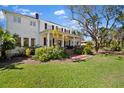 Charming two-story home with inviting front porch, landscaped yard, and beautiful curb appeal at 813 Hudson Ave, Sarasota, FL 34236
