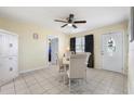 Dining room with stylish tile flooring, elegant table set, and bright natural light at 8798 Herbison Ave, North Port, FL 34287
