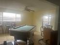 Spacious game room with a pool table and plenty of room at 965 Whitman Dr, Sarasota, FL 34243