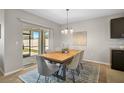 Dining area with sliding glass doors leading to the backyard patio at 15408 Trinity Fall Way, Bradenton, FL 34212