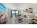 Comfortable living room with plush seating and view of the balcony at 17510 Gawthrop Dr # 305, Bradenton, FL 34211
