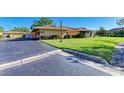 Charming home with lush lawn, mature shrubbery, and a well-maintained blacktop driveway at 2233 Beneva Ter # 2232, Sarasota, FL 34232