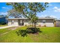 Charming single-story home with fresh exterior paint and a well-maintained lawn, presenting great curb appeal at 2361 Rose St, Sarasota, FL 34239