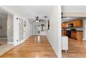 Bright open-concept layout with hardwood flooring connecting the living area to the kitchen, great for entertaining at 2361 Rose St, Sarasota, FL 34239