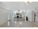 Bright and airy living room with high ceilings, fireplace and open floor plan concept at 3704 Prairie Dunes Dr, Sarasota, FL 34238
