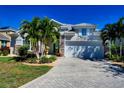 Charming two-story home with well-manicured lawn and paver driveway in a desirable neighborhood at 3707 5Th Ne Ave, Bradenton, FL 34208