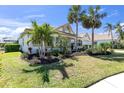 Stunning home with manicured lawn, lush landscaping, and beautiful curb appeal at 4624 Blue Marlin Dr, Bradenton, FL 34208