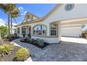 Well-maintained home showcasing beautiful arched windows and a stylish walkway at 4624 Blue Marlin Dr, Bradenton, FL 34208