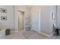 Inviting foyer with decor and a view of the home's interior at 6172 Lungo Lago Dr, Sarasota, FL 34241