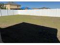 Spacious backyard enclosed by a white privacy fence at 15517 Rose Grove Dr, Bradenton, FL 34212