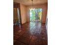 Open-concept dining room with natural light and tile flooring at 1862 Orangewood Ln, Sarasota, FL 34232