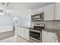 Well-appointed kitchen with stainless steel appliances and modern backsplash at 2039 Kai Dr, Sarasota, FL 34231