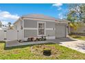 Well-maintained single-Gathering home featuring a two-car garage, fresh landscaping, and a charming front yard at 2408 28Th E Ave, Palmetto, FL 34221
