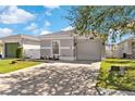 Charming single-Gathering home with a well-maintained lawn and a two-car garage at 2408 28Th E Ave, Palmetto, FL 34221