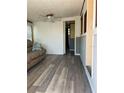 Living room with neutral walls, ceiling fan, and wood look flooring at 2601 Gulf N Dr # 214, Bradenton Beach, FL 34217