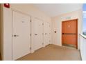 Well-maintained hallway featuring multiple storage and exterior access doors at 2625 Terra Ceia Bay Blvd # 506, Palmetto, FL 34221
