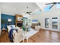 Inviting living room with stone fireplace, wood floors, and vaulted ceilings with lots of natural light at 4406 17Th W St, Palmetto, FL 34221