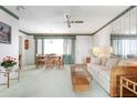 Bright living room featuring a ceiling fan, neutral paint, and space for a dining area at 4440 Ironwood Cir # 509D, Bradenton, FL 34209