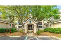Inviting building entrance with well-maintained landscaping, clearly marked signage, and easy access at 5160 Northridge Rd # 206, Sarasota, FL 34238