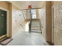 Clean, well lit hallway with stairs leading to upper floors in the building at 5160 Northridge Rd # 206, Sarasota, FL 34238