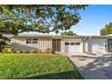Inviting single-story home with a lush green lawn and a double garage at 7122 11Th W Ave, Bradenton, FL 34209