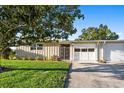 Charming single-story home with a well-manicured lawn and a covered front entrance at 7122 11Th W Ave, Bradenton, FL 34209