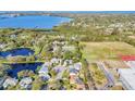 Breathtaking aerial view showcasing the community's landscape, a large lake and stunning waterfront homes at 7612 4Th Avenue Nw Dr, Bradenton, FL 34209