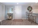 Entryway featuring a modern countertop, mirror, and wall decor at 1080 Peppertree W Ln # 602, Sarasota, FL 34242