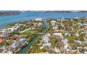 Captivating aerial view of a waterfront community along a winding canal to the beautiful ocean at 111 Faubel St, Sarasota, FL 34242